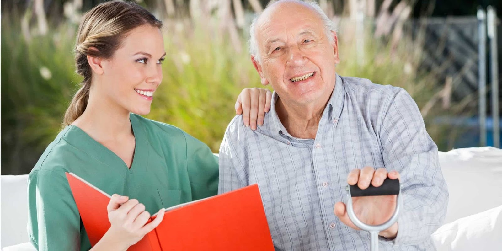 Alzheimer's patient/ parent smiling with caregiver in disease progression 