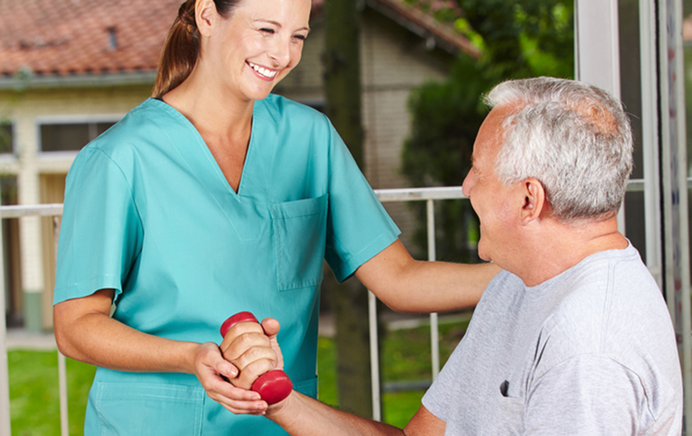 professional caregiving taking care of a Parkinson's patient at their homes